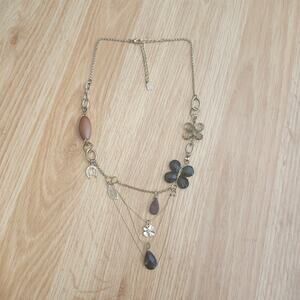 You and I Gold Tone Statement Necklace Clover Horseshoe Floral Teardrop Drape